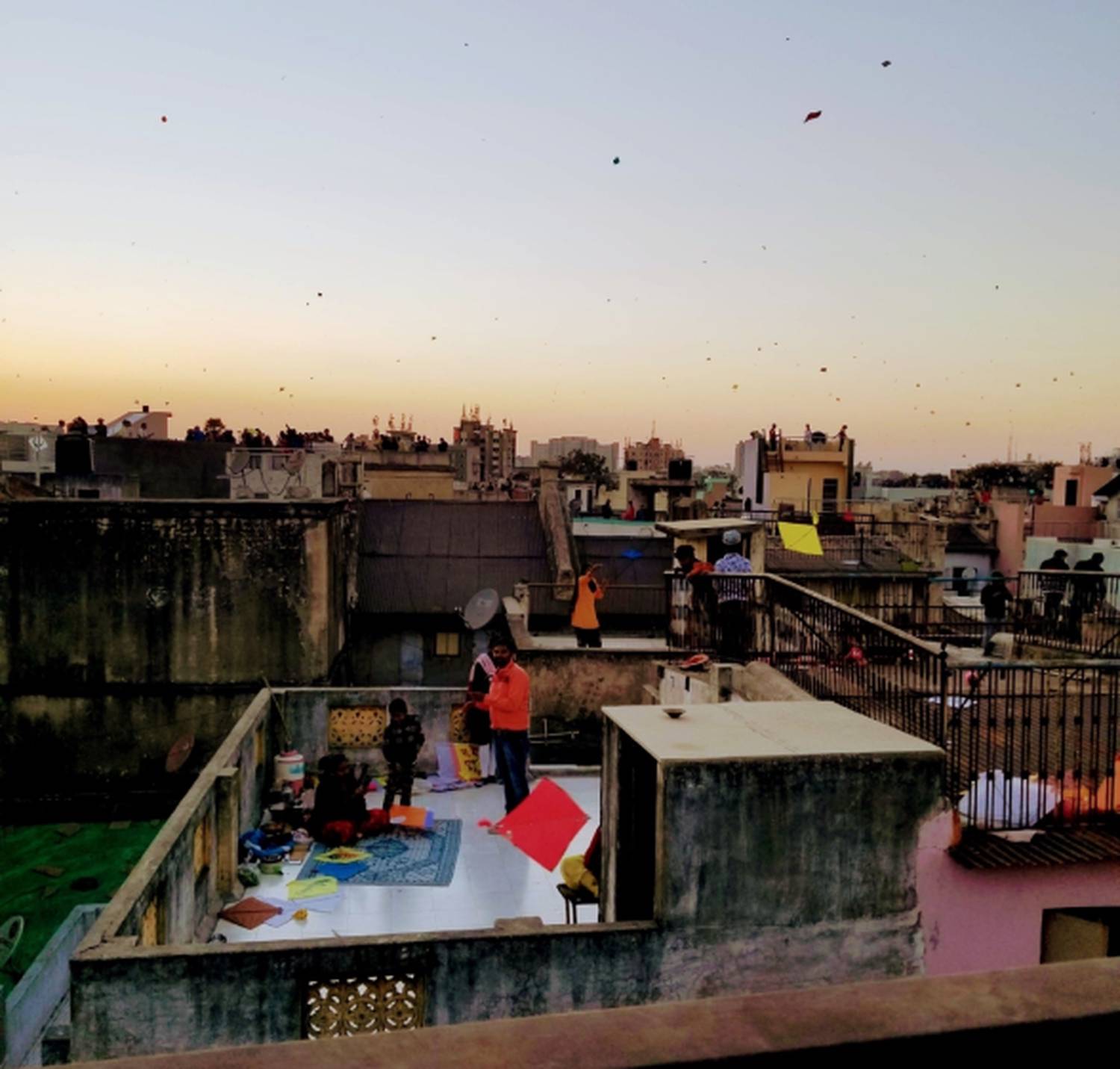 "curious, creative, compassionate" over an image of people flying kites